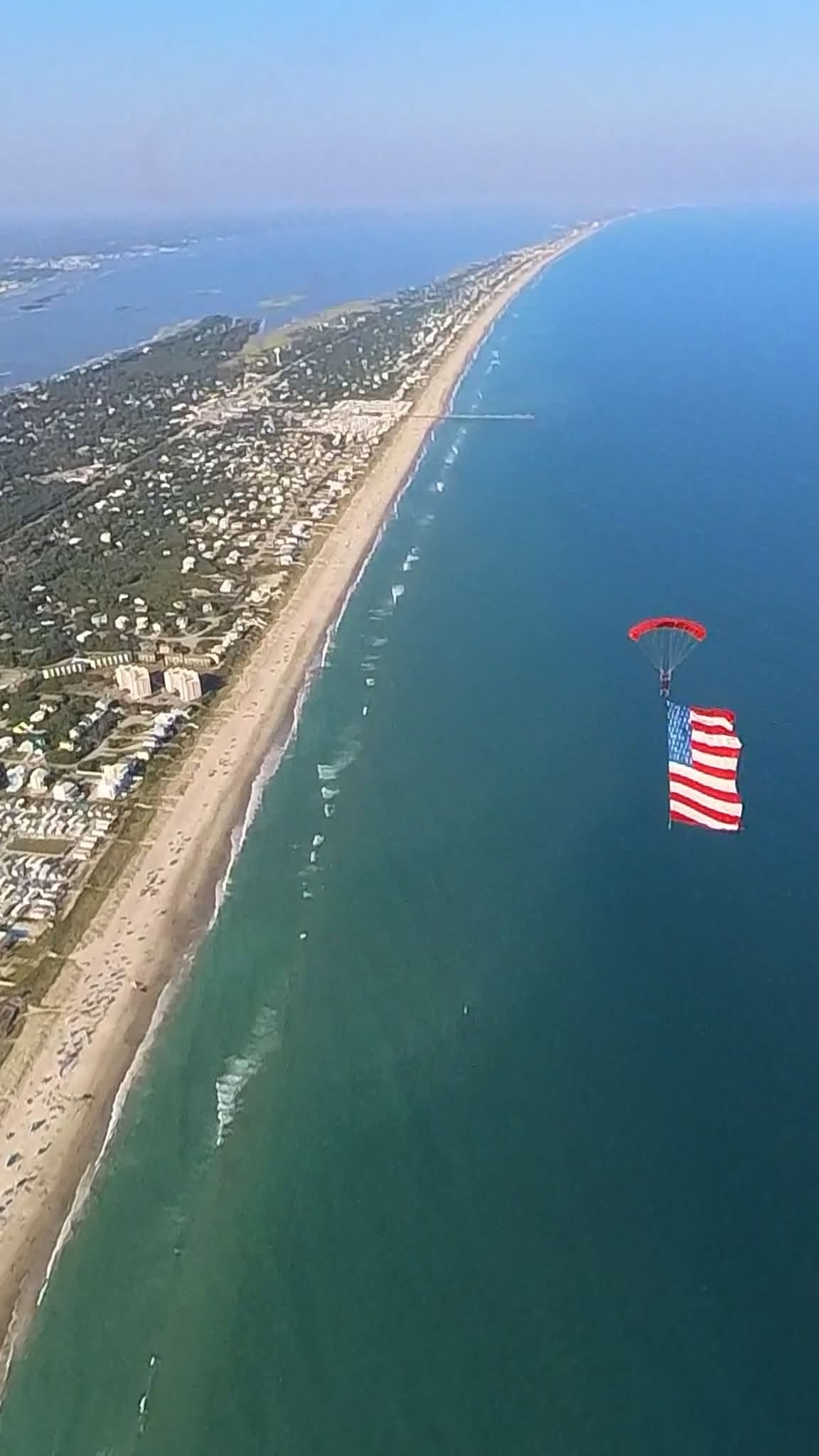 American flag flown under canopy above the Atlantic at Emerald Isle, NC