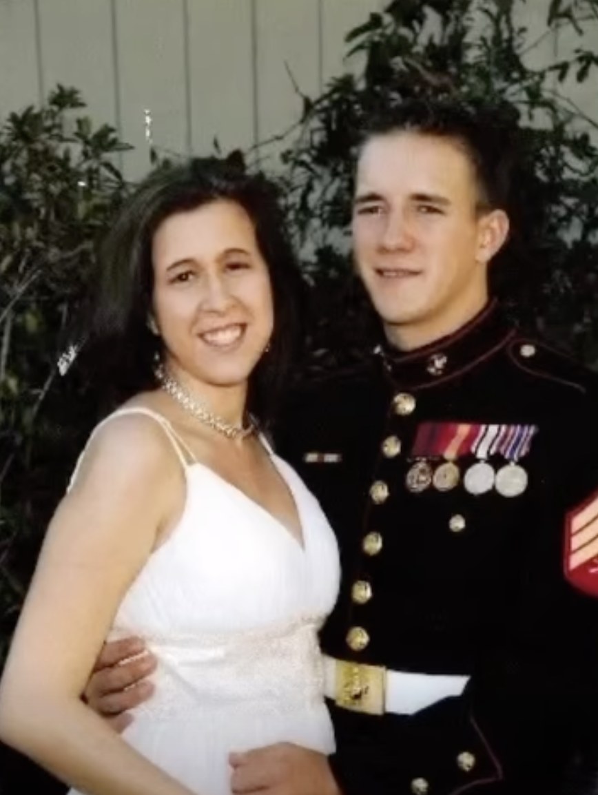 Brandon Schmidt in Marine Corps dress blues with his wife.