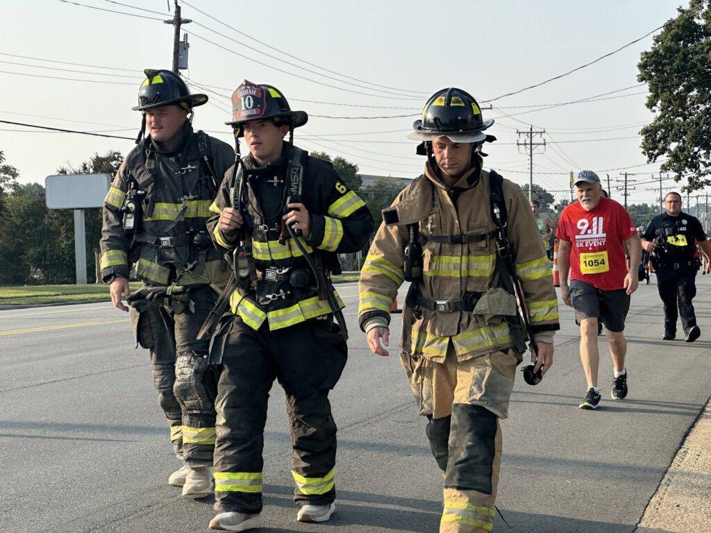 Community members at the 25th Anniversary 9/11 Commemorative 5K in Graham, North Carolina.