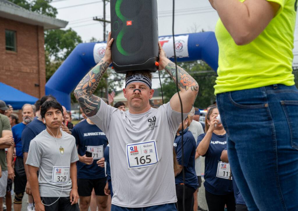 Community members at the 25th Anniversary 9/11 Commemorative 5K in Graham, North Carolina.