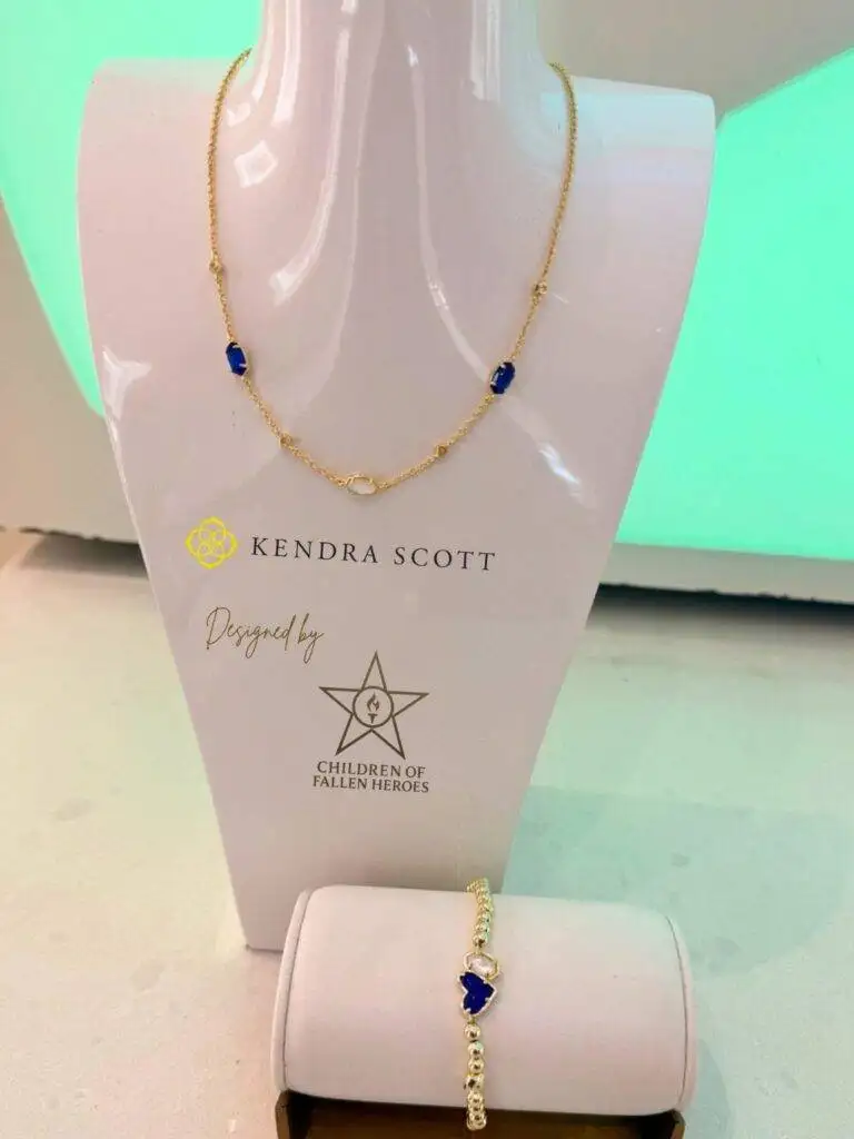 The Kendra Scott necklace and bracelet designed with the Children of Fallen Heroes Next Gen Team, displayed with Kendra Scott and Children of Fallen Heroes branding